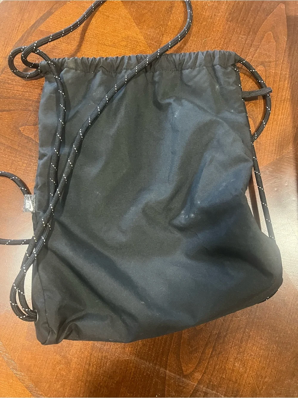 Nike Black Drawstring Backpack with White Swoosh Logo